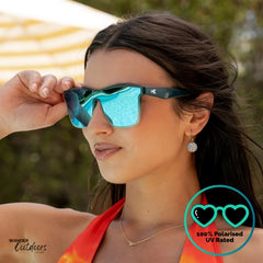 Knockaround Afters Seoul Sunglasses with blue lenses and gradient blue frames at the pool, unisex polarised and UV400 Rating.