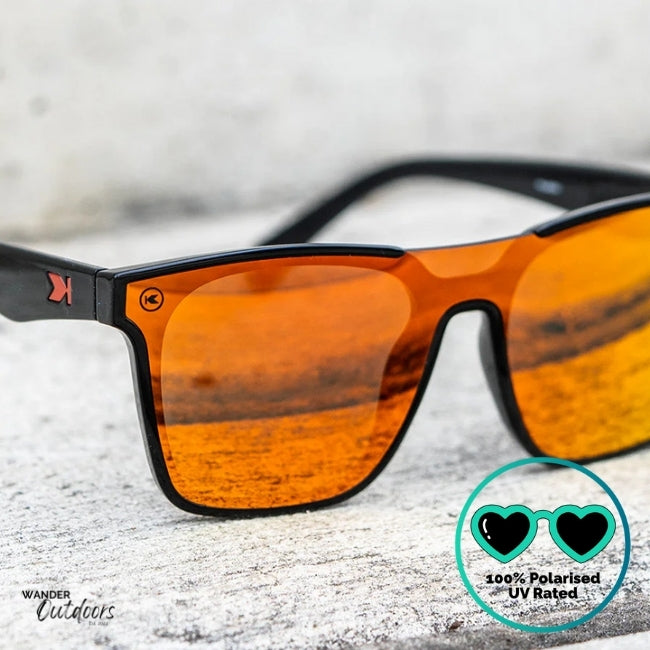 Knockaround Afters Venezia Sunglasses with Red lenses and black frames front view close up, polarised and UV400 Rating.