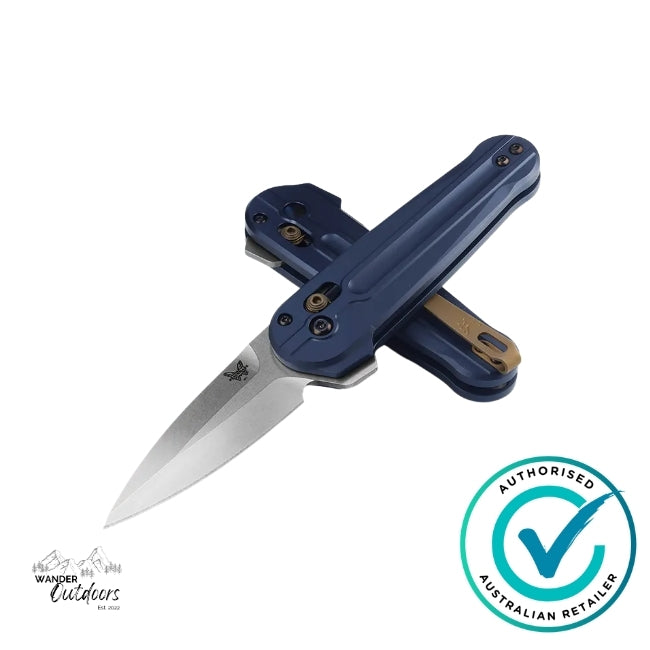 Benchmade 491 Lowden folding knife with Crater Blue anodised aluminium handles shown open and crossed, displaying spear-point M390 blade and bronze deep-carry clip – authorised Australian retailer logo included.