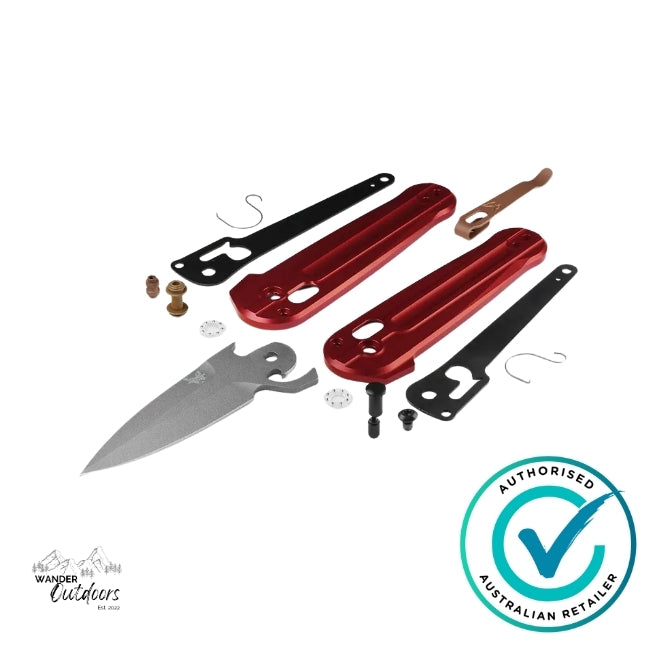 Benchmade 491GY-01 Lowden folding knife disassembled showing red aluminium handle scales, grey Cerakote M390 blade, and internal AXIS Lock components.