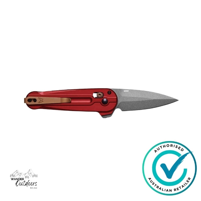 Benchmade 491GY-01 Lowden knife with blade open on flat surface, showing red handle and bronze deep-carry pocket clip.