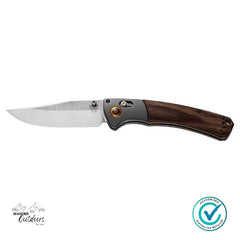 Folding knife with wooden handle on a white background