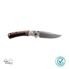 Folding knife with wooden handle on a white background, featuring Wander Outdoors branding.