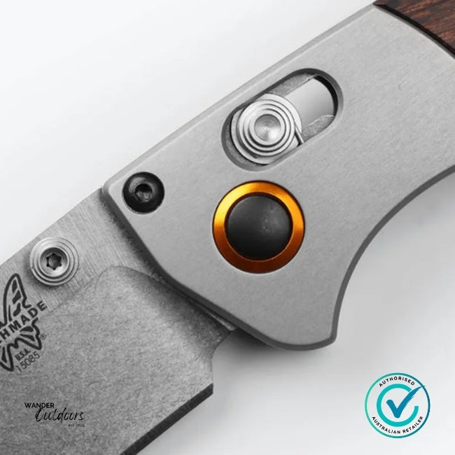 Close-up of a knife with a visible brand logo on a white background