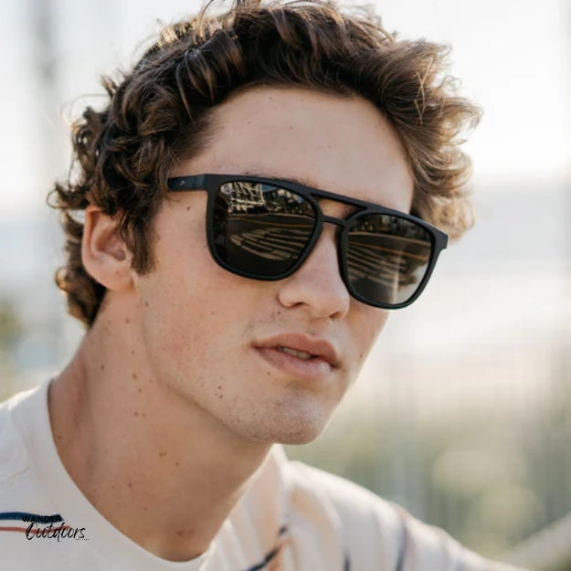 affordable polarised unisex knockaround brightsides sunglasses in black frames male wearing'