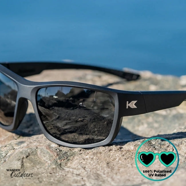 Knockaround High Stakes Blackout Sunglasses black frames and black salt water resistant lenses, unisex design fully polarised partial close up of lenses and side view of frame with K Logo., fishing.