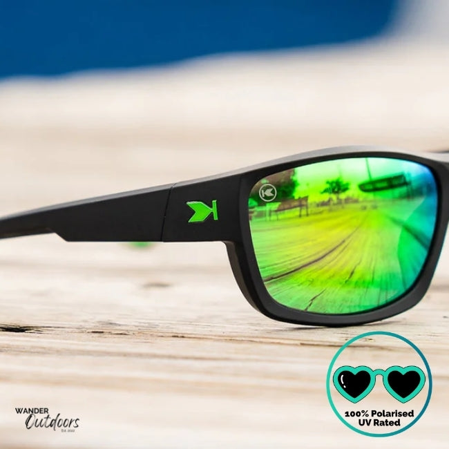Knockaround High Stakes Vortex Sunglasses black frames and green salt water resistant lenses, unisex design fully polarised close up of lense and frame with K Logo.