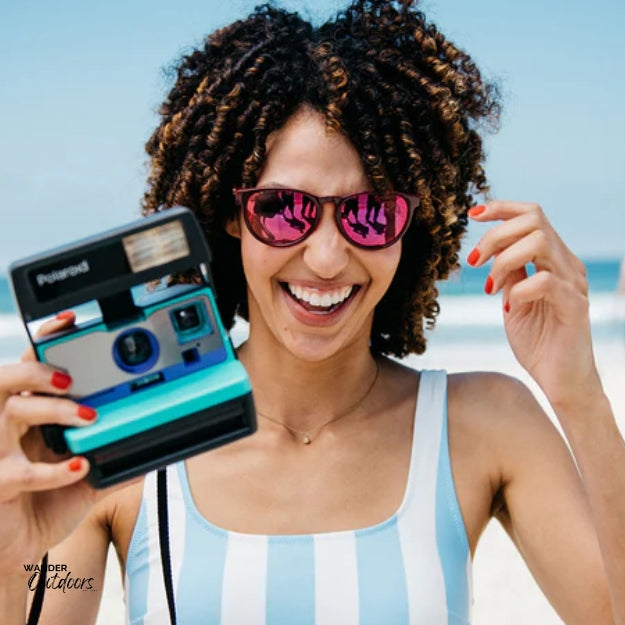 Knockaround Mai Tais Sunglasses Watermelon Geode Lady on Beach with Camera