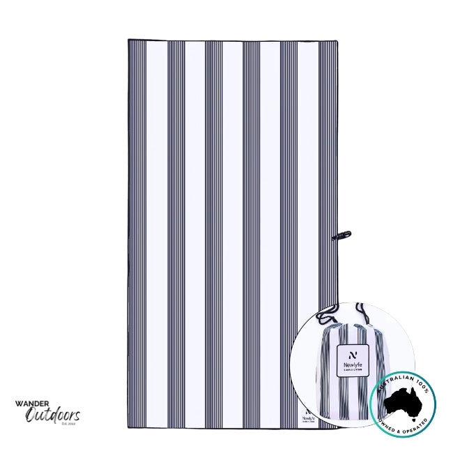 Flat-lay of Newlyfe Signature Amalfi Navy Sand-Free Towel showing navy and white vertical stripes.