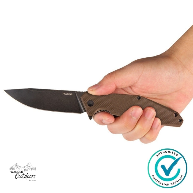 Ruike D191-W folding knife held in hand, showing ergonomic brown G10 grip and sharp stonewashed blade — genuine product from Wander Outdoors Australia.