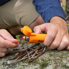 SOL Fire Lite™ Fuel-Free Lighter Lighting a camp fire