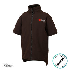 Product photo of the Stoney Creek Kids Rammer Jacket in dark brown with short sleeves, full-length front zipper, and embroidered red logo on the chest. Plain white background with Wander Outdoors and New Zealand Owned & Operated badges.