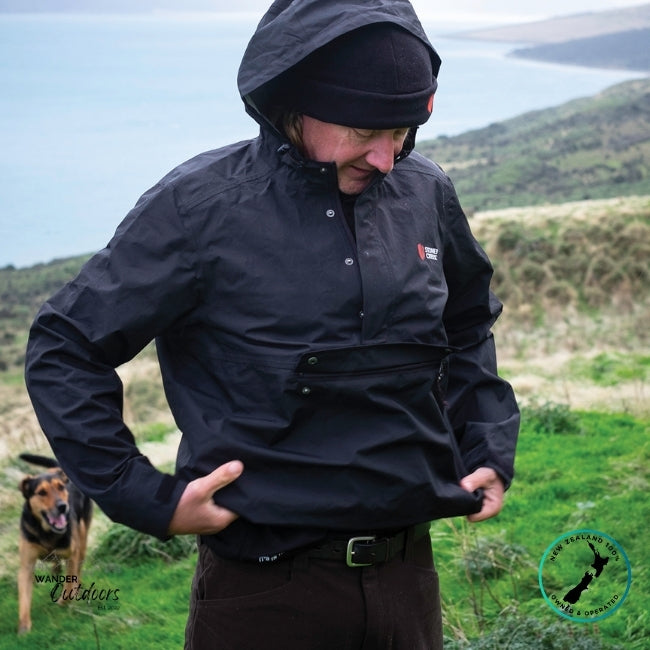 Person wearing Stoney Creek Recreational (Stow it) Jacket in Black in a scenic outdoor setting
