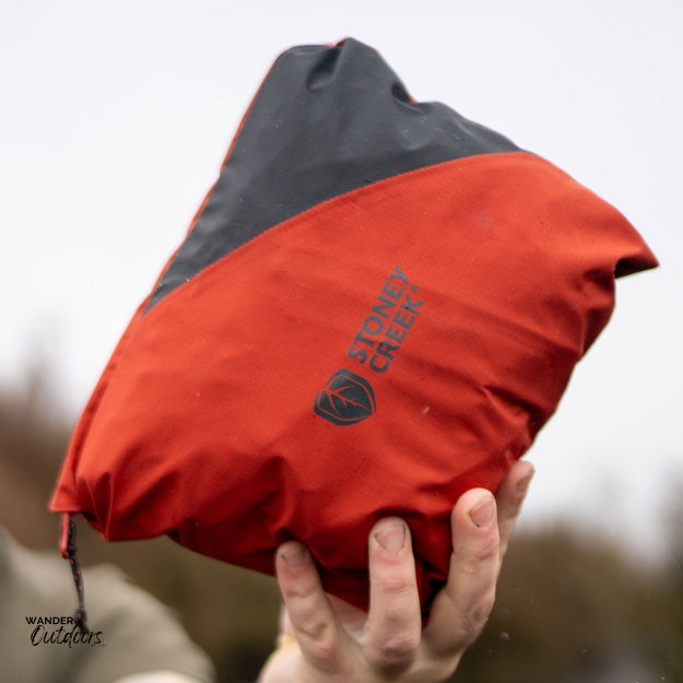 Stoney Creek Stow It Pro Jacket Ketchup Black Packed Up into Front Pocket