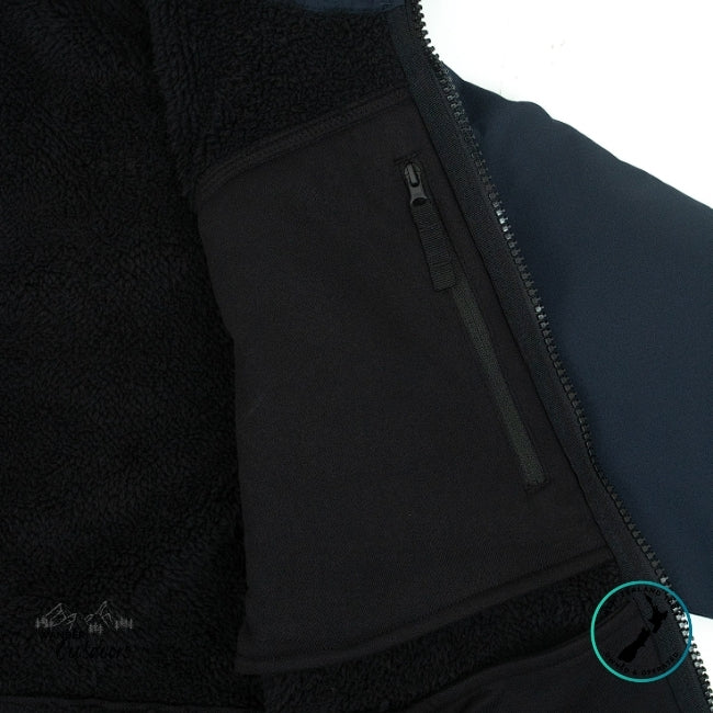 Close-up of a black jacket with a zipper and textured fabric
