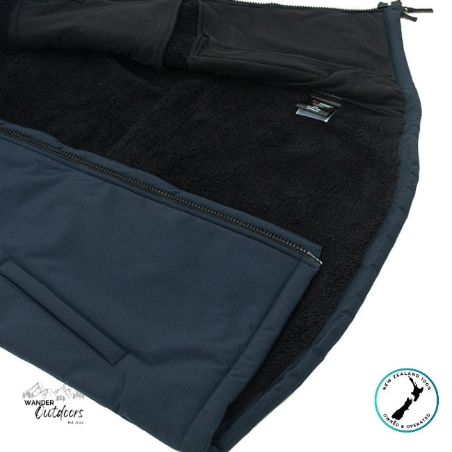 Close-up of a black fleece lining with a zipper on a blue fabric, featuring Wander Outdoors branding.