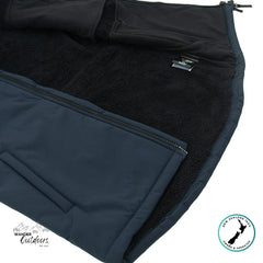 Close-up of a black fleece lining with a zipper on a blue fabric, featuring Wander Outdoors branding.