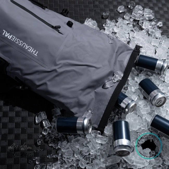 Gray cooler bag with ice and coolers on a textured surface