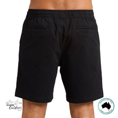 The Mad Hueys Black shorts worn by a person rear facing view on a white background