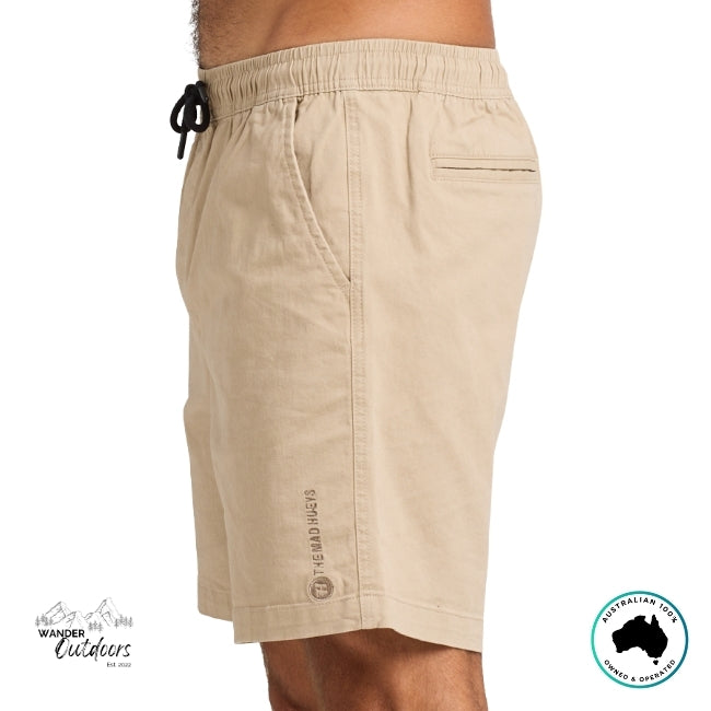 Taupe shorts with The Mad Hueys Brand Logo side view on a white background