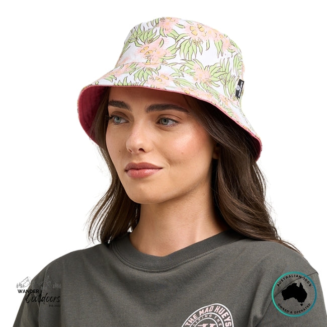 Woman wearing a floral bucket hat on a white background
