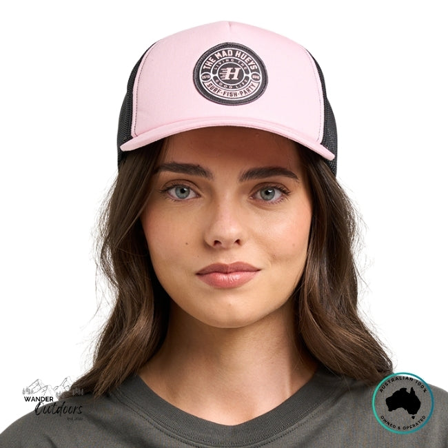 Person wearing a pink and black cap with The Mad Hueys Good Life Logo on a white background