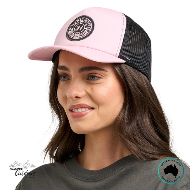 Woman wearing a pink and black cap with The Mad Hueys Good Life Logo on a white background