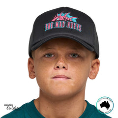 Front view of The Mad Hueys Kids King Cod Codzilla Foam Trucker Hat in black with bold pink and aqua fish logo print.