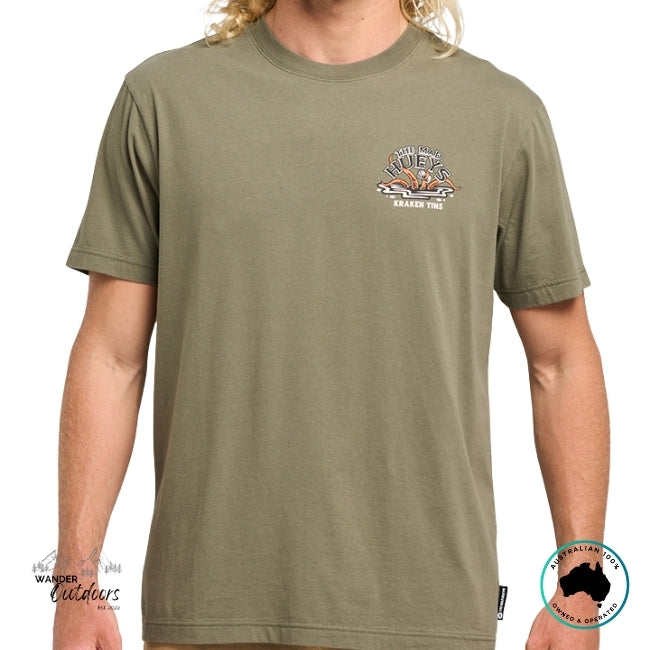 Person wearing a green t-shirt with The Mad Hueys Kraken Design on a white background