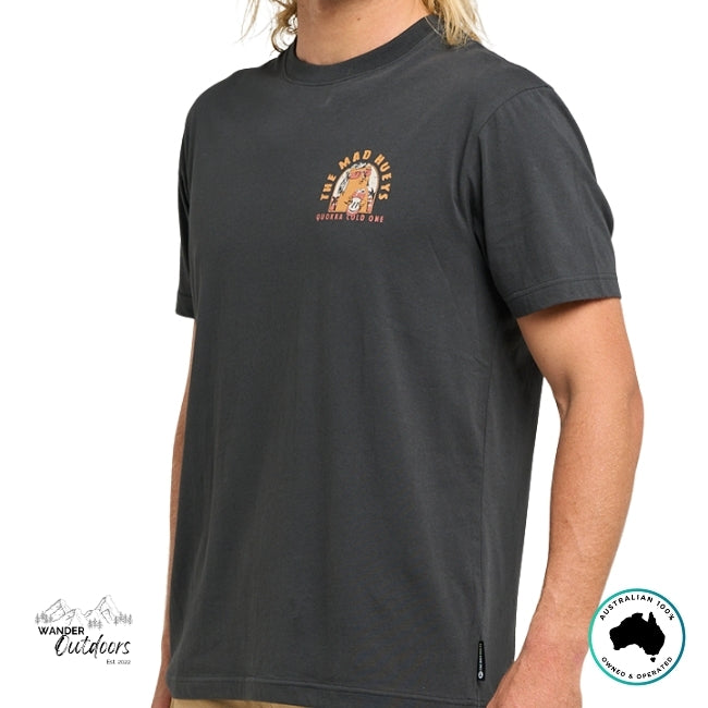Person wearing a black t-shirt with The Mad Hueys Logo and a Quokka character on a white background