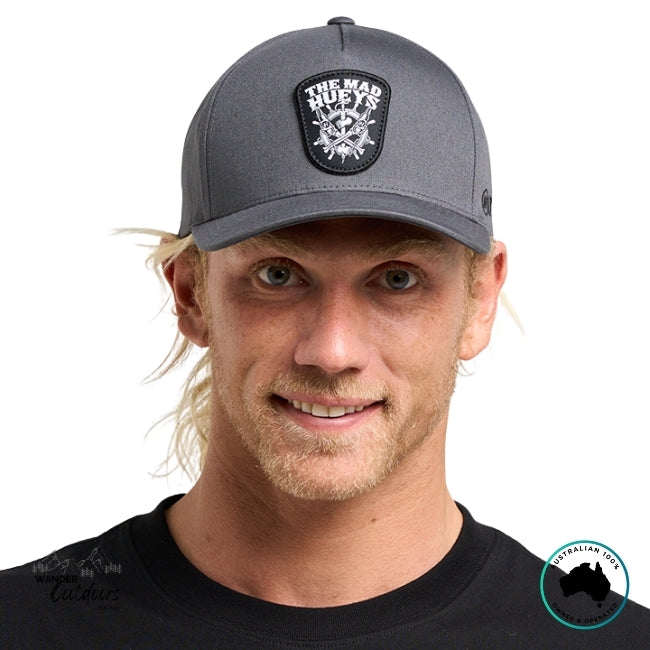 Man wearing a grey cap with The Mad Hueys Ship, Wheel, Beers Logo on a white background