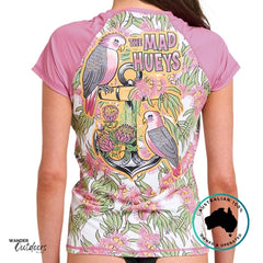 Person wearing a shirt with a colorful design and 'The Mad Hueys' branding.