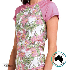 Floral-patterned shirt with pink sleeves on a white background, featuring the Wander Outdoors brand.