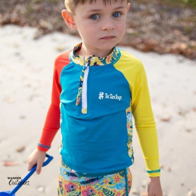 A boy on the beach front view of the aussie animalia rashie