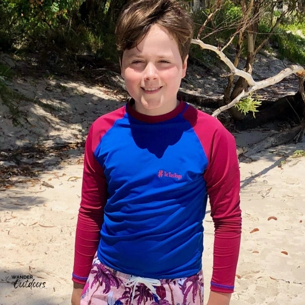 Ready to hit some waves at the beach in the surfs up rashie