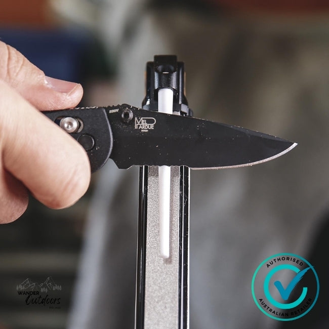 Sharpening a partially serrated knife on the Work Sharp WSBCHAGS Angle Set Sharpener using the fine ceramic rod – Wander Outdoors authorised Australian retailer.