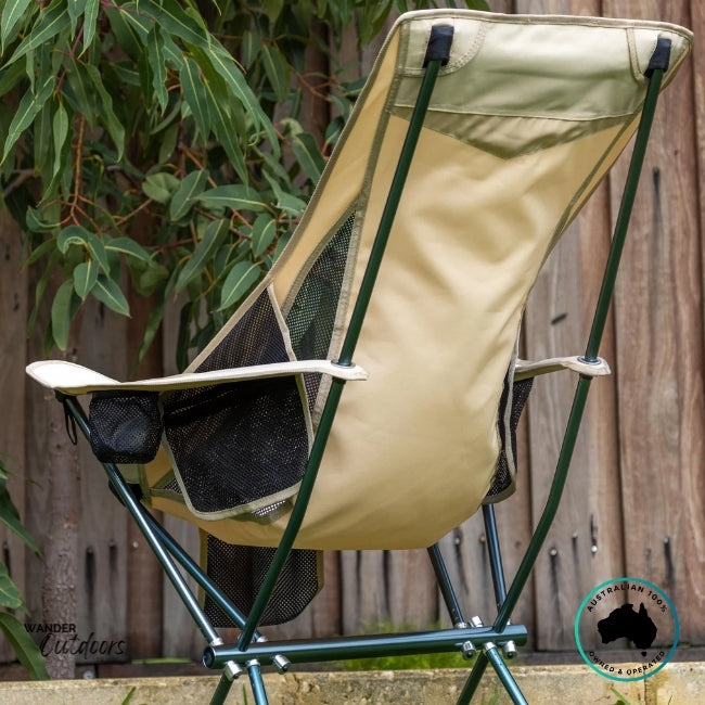 Rear view of beige Dhubite Outdoors compact camp chair showing durable frame design and breathable mesh back panels.