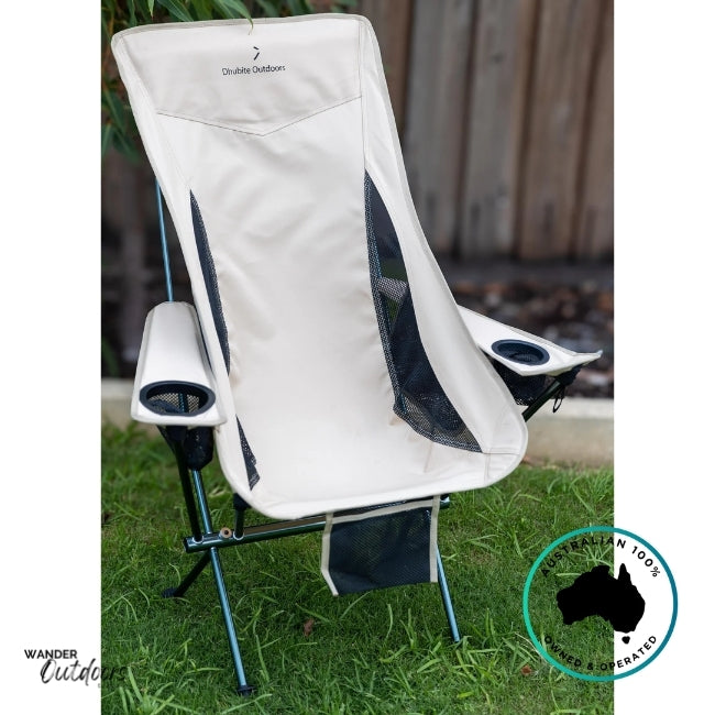 Front view of Dhubite Outdoors beige camp chair with mesh side panels, padded headrest, and twin armrests, set on green grass.