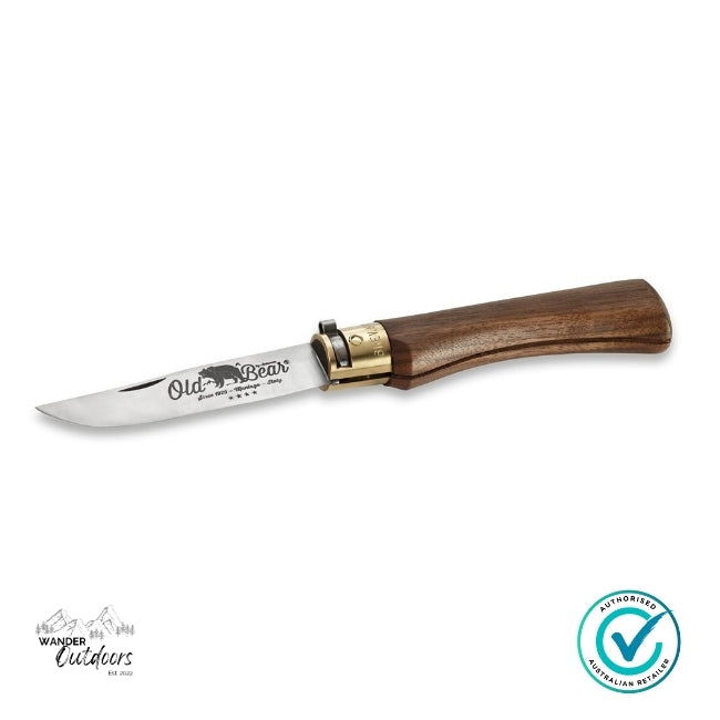 Knife with wooden handle and 'Old Bear' branding on a white background