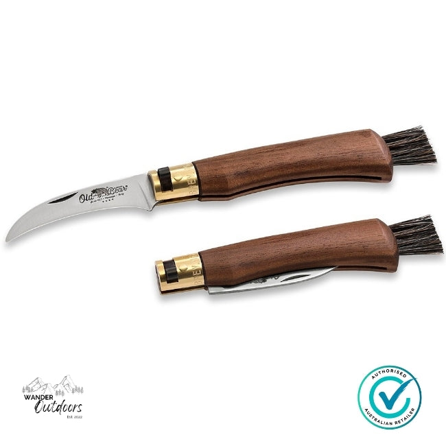 Two wooden-handled knives with brush attachments on a white background, featuring the Wander Outdoors logo.
