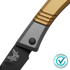 Close-up of Benchmade Successor 315BK-01 handle detail showing precision-machined brass and grey aluminium scales with pivot hardware.