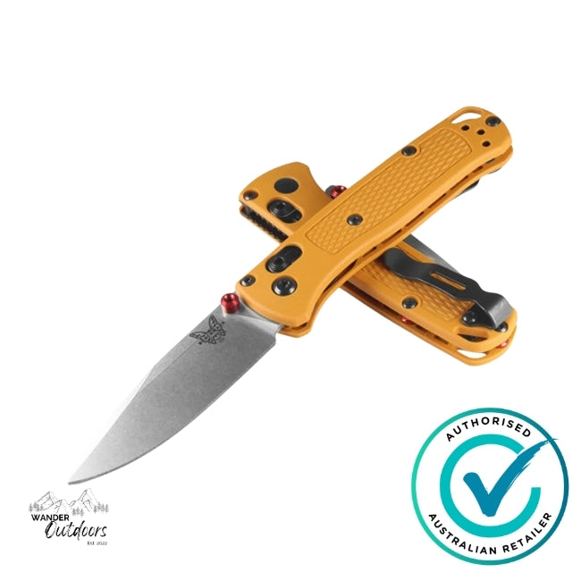 Orange folding knife with a visible brand logo on a white background