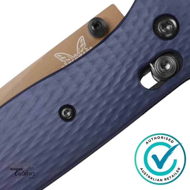 Close-up of a blue knife handle with a brand logo and 'Authorized Australian Retailer' badge.