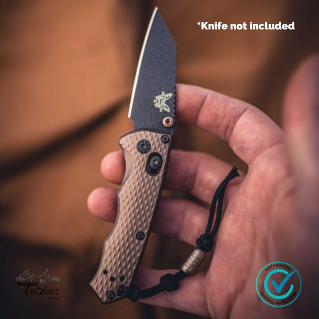 Hand holding a knife with a blurred background