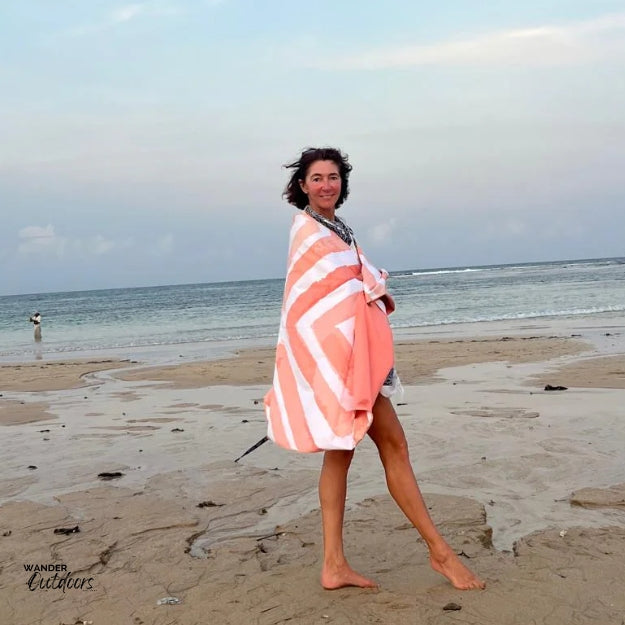 Newlyfe Beach Towel & Pouch in Coral Reef on the beach