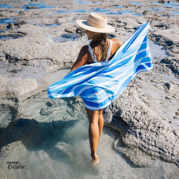 Newlyfe Beach Towel & Pouch Ocean Blue on the rock pools