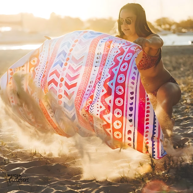 Newlyfe Beach Towel & Pouch Pink Sands shaking off the sand