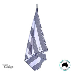 Newlyfe Signature Amalfi Navy Towel hanging neatly from loop showing crisp stripe pattern.