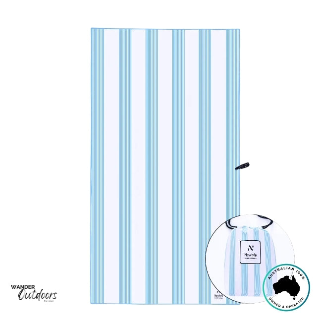 Flat lay of the Newlyfe Signature Calvi Sky Blue Towel showing its clean striped pattern and included matching storage pouch.