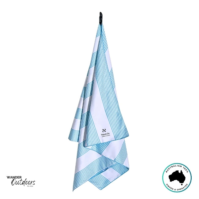 Newlyfe Signature Calvi Sky Blue Sand-Free Towel with included matching striped pouch.